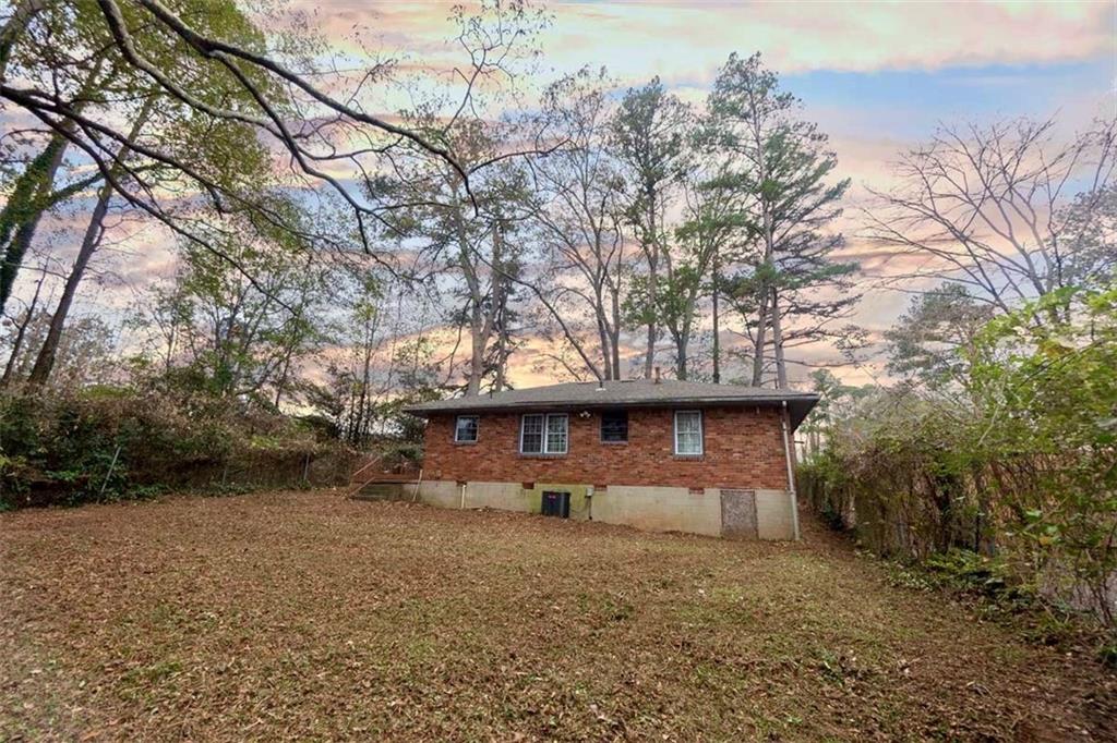 3308 Fern Drive Tucker, GA 30084 - Photo 18 of 19 a view of a house with a yard and tree