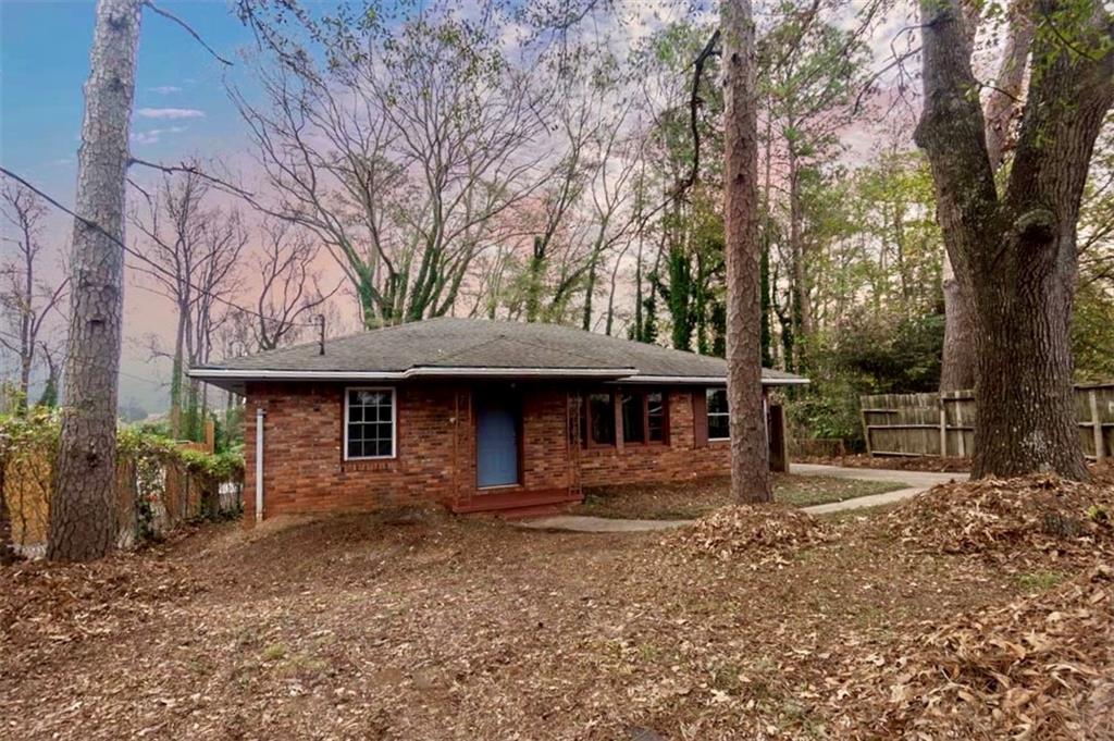 3308 Fern Drive Tucker, GA 30084 - Photo 5 of 19 a front view of a house with garden