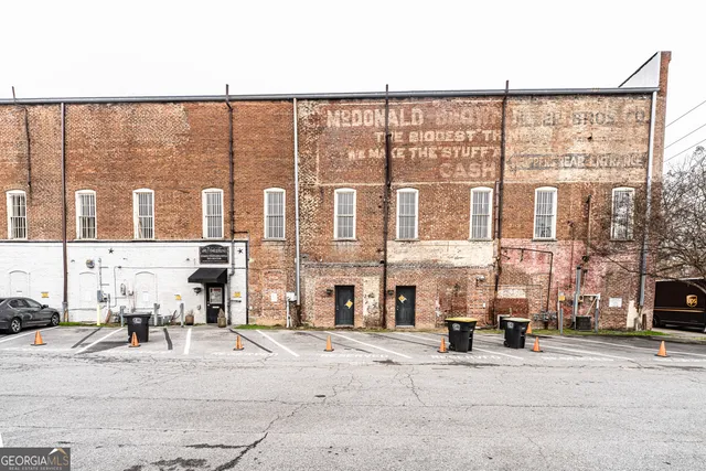 a city street lined with buildings and a street
