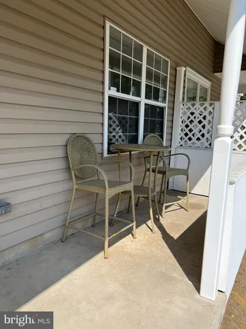 a view of a chairs and table in the patio