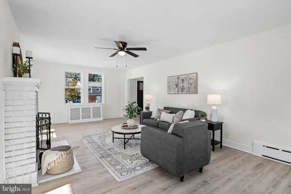 a living room with furniture and windows