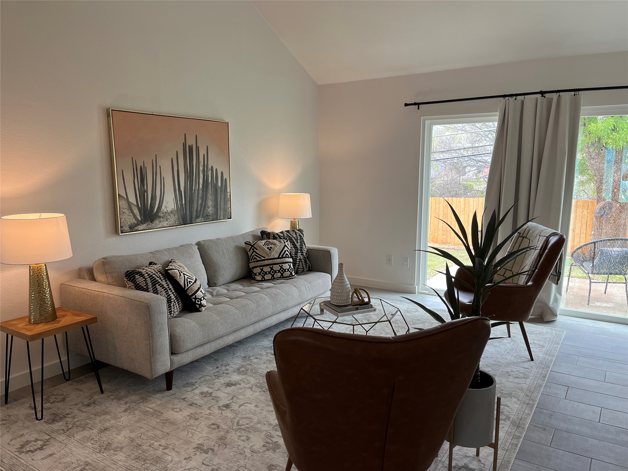 9502 Crown Ridge Road Austin, TX 78753 - Photo 2 of 8 Living area featuring plenty of natural light and lofted ceiling