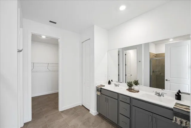 a bathroom with a double vanity sink mirror and double