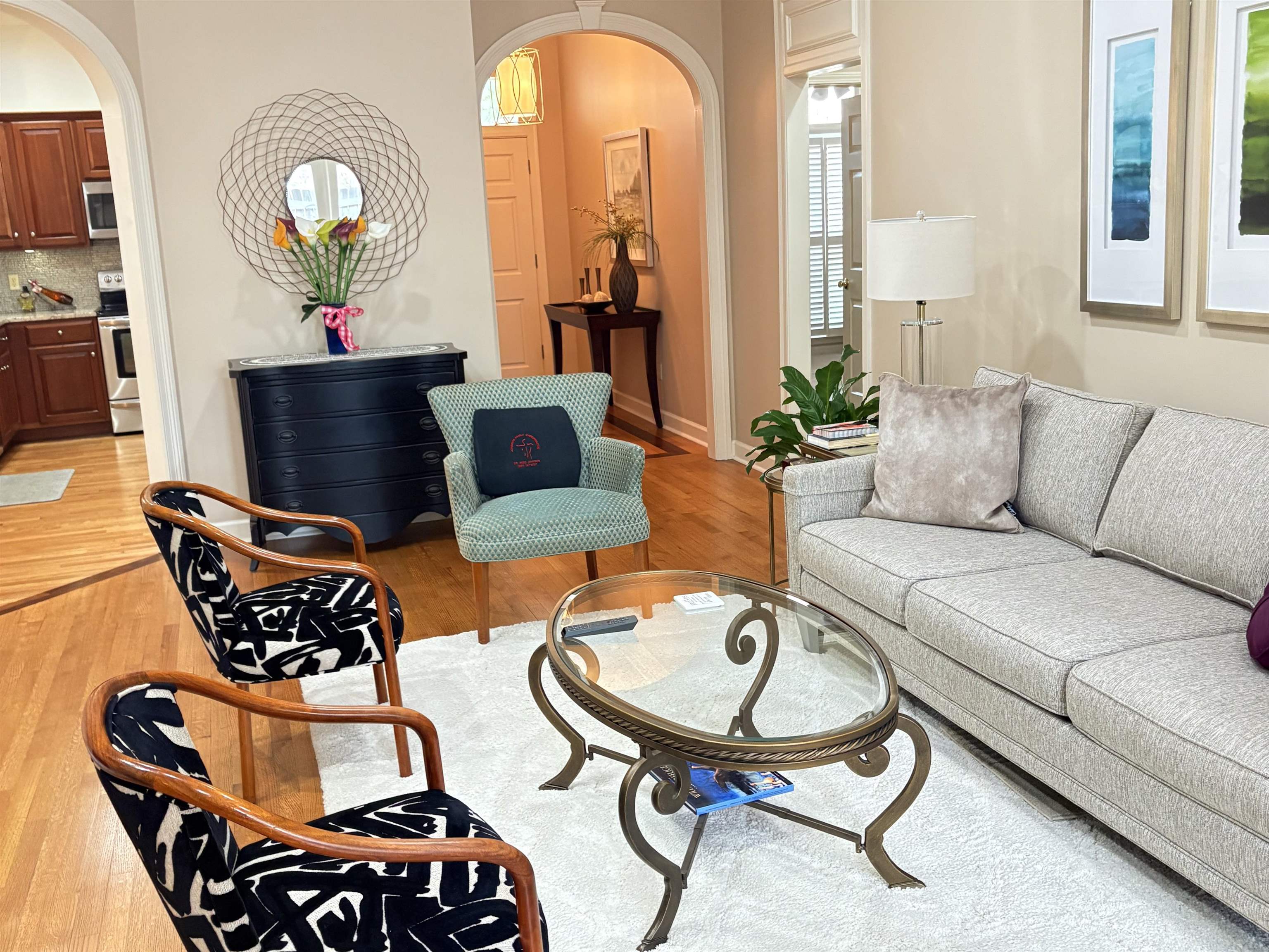 1730 Gosnold Bluff Road Collierville, TN 38017 - Photo 7 of 15 Living room with arched walkways and light wood finished floors