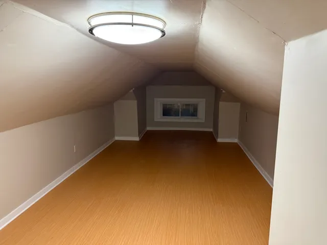 an empty room with a empty space and windows