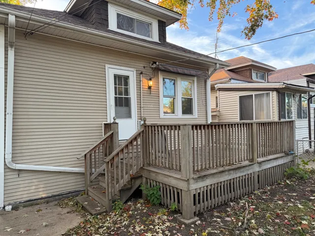 a view of a brick house with a large windows