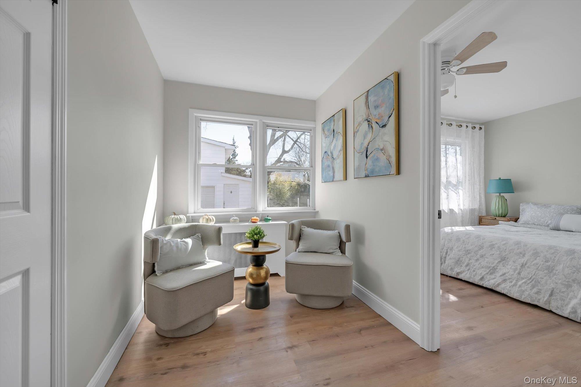 31 Walters Avenue Syosset, NY 11791 - Photo 14 of 29 a living room with furniture and a large window