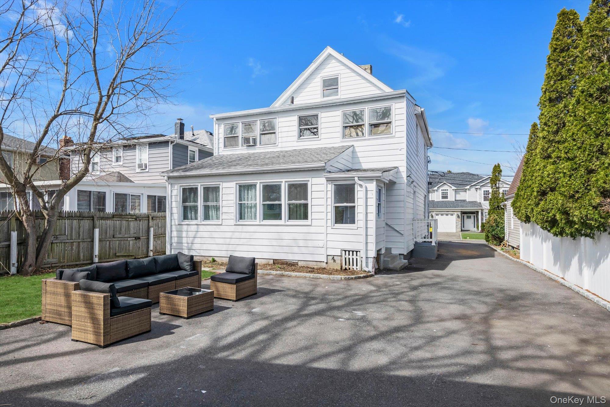 31 Walters Avenue Syosset, NY 11791 - Photo 25 of 29 a front view of a house with a yard
