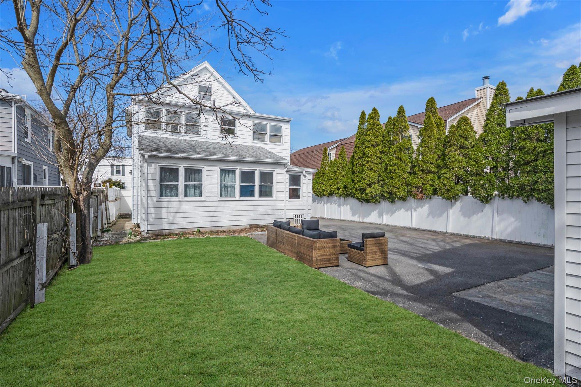 31 Walters Avenue Syosset, NY 11791 - Photo 26 of 29 a view of a house with backyard sitting area and garden