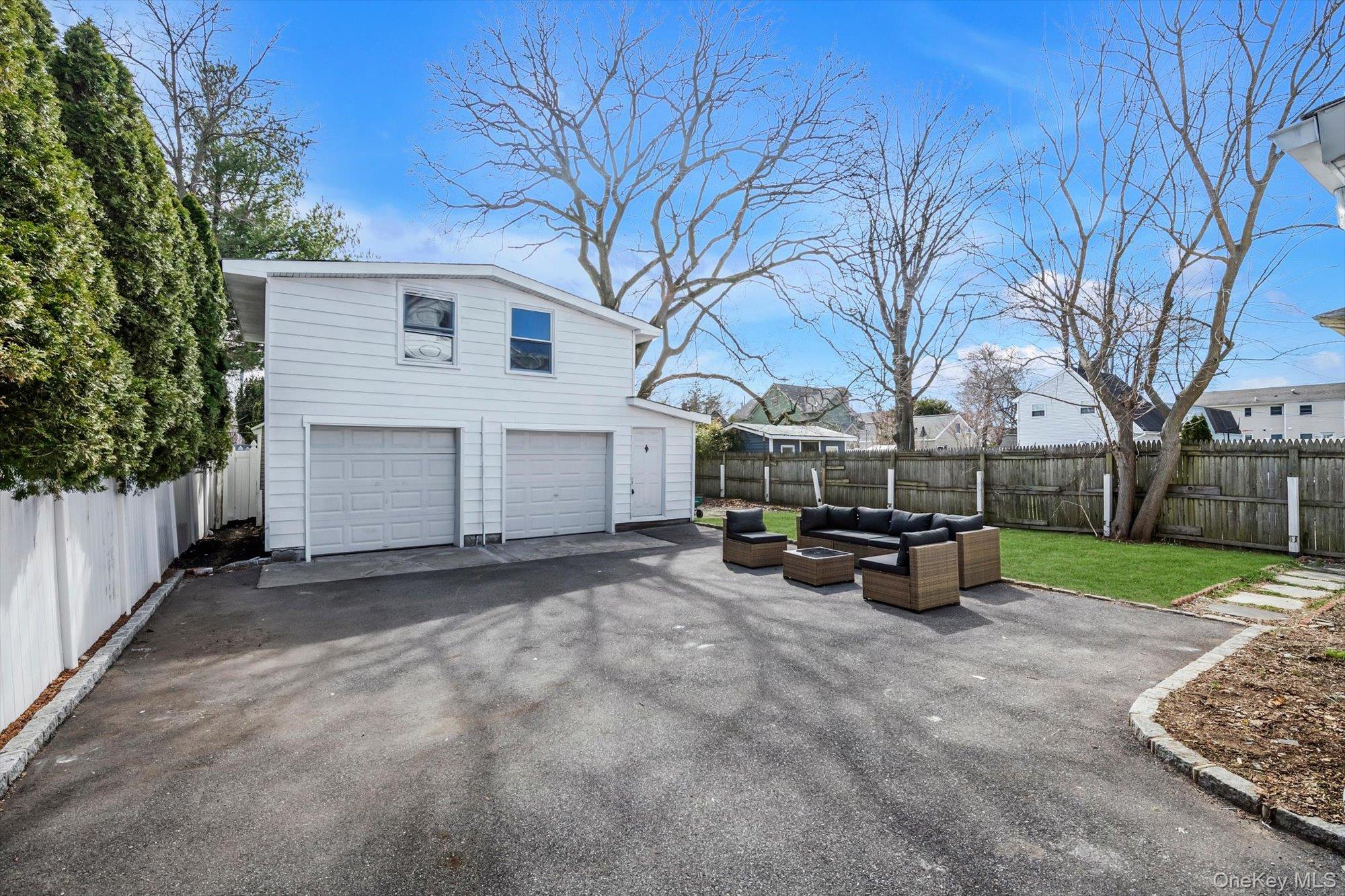 31 Walters Avenue Syosset, NY 11791 - Photo 27 of 29 a view of a house with backyard and a trees
