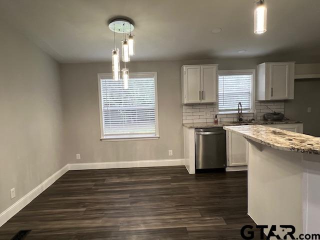 174 County Road 2604 Pittsburg, TX 75686 - Photo 14 of 22 a kitchen with a stove a sink and a window