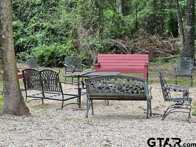 174 County Road 2604 Pittsburg, TX 75686 - Photo 19 of 22 a view of a bench in a backyard