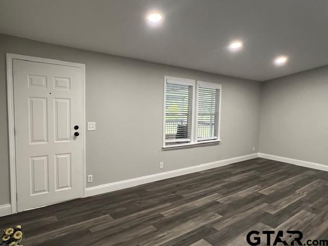 174 County Road 2604 Pittsburg, TX 75686 - Photo 4 of 22 a view of an empty room with wooden floor and a window