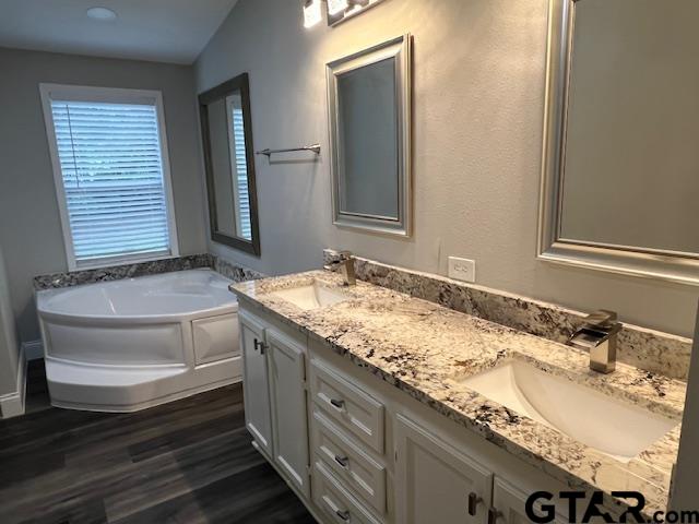 174 County Road 2604 Pittsburg, TX 75686 - Photo 7 of 22 a bathroom with a granite countertop sink and a mirror