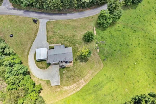 a view of house with outdoor space and swimming pool