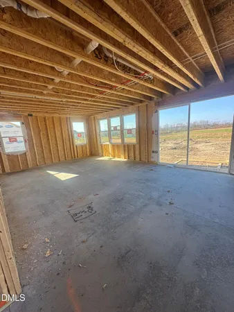 a view of an empty room with a fireplace