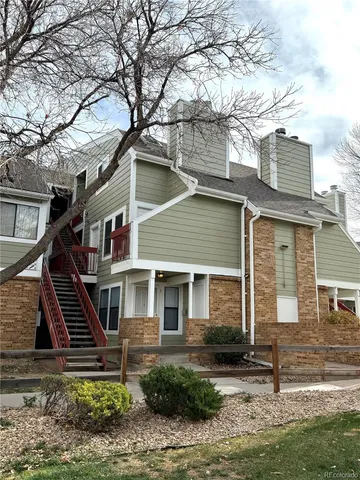a front view of a house with stairs