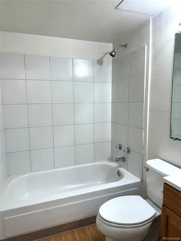 a bathroom with a toilet bathtub and shower