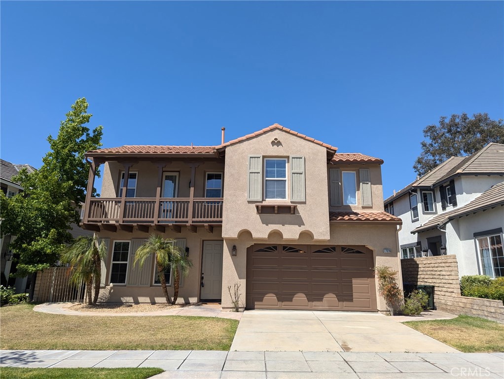 27020 Island Road Valencia, CA 91355 - Photo 1 of 1 a front view of a house with a garden