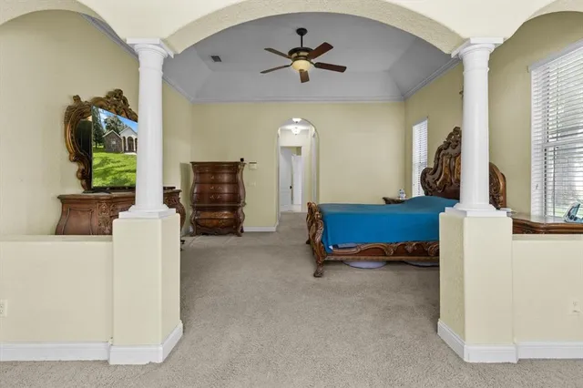 a spacious bathroom with a double vanity sink a mirror and a shower