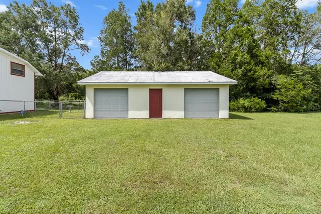 a view of a back yard of the house