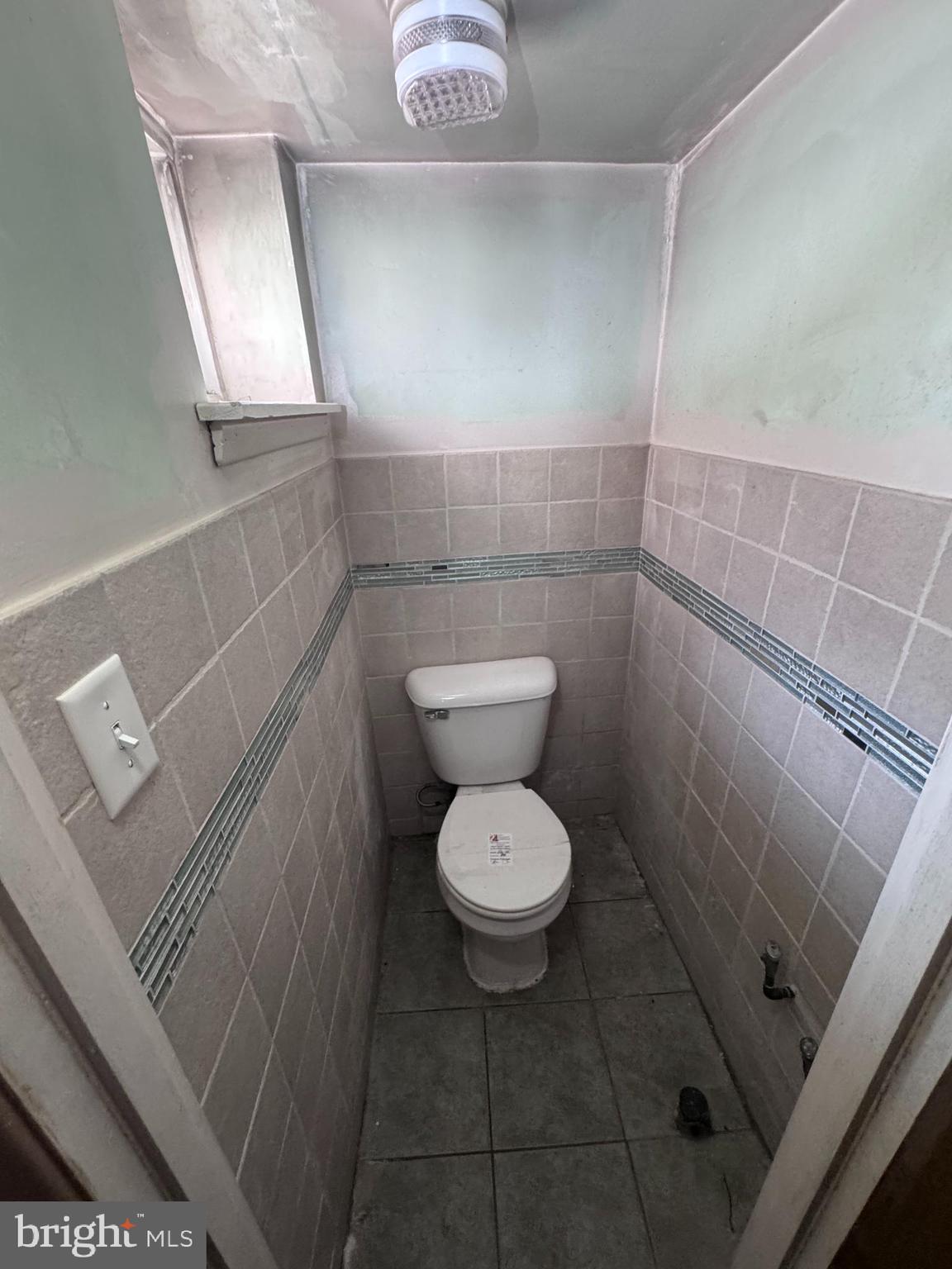 7448 Rhoads Street Philadelphia, PA 19151 - Photo 16 of 17 a bathroom with a toilet