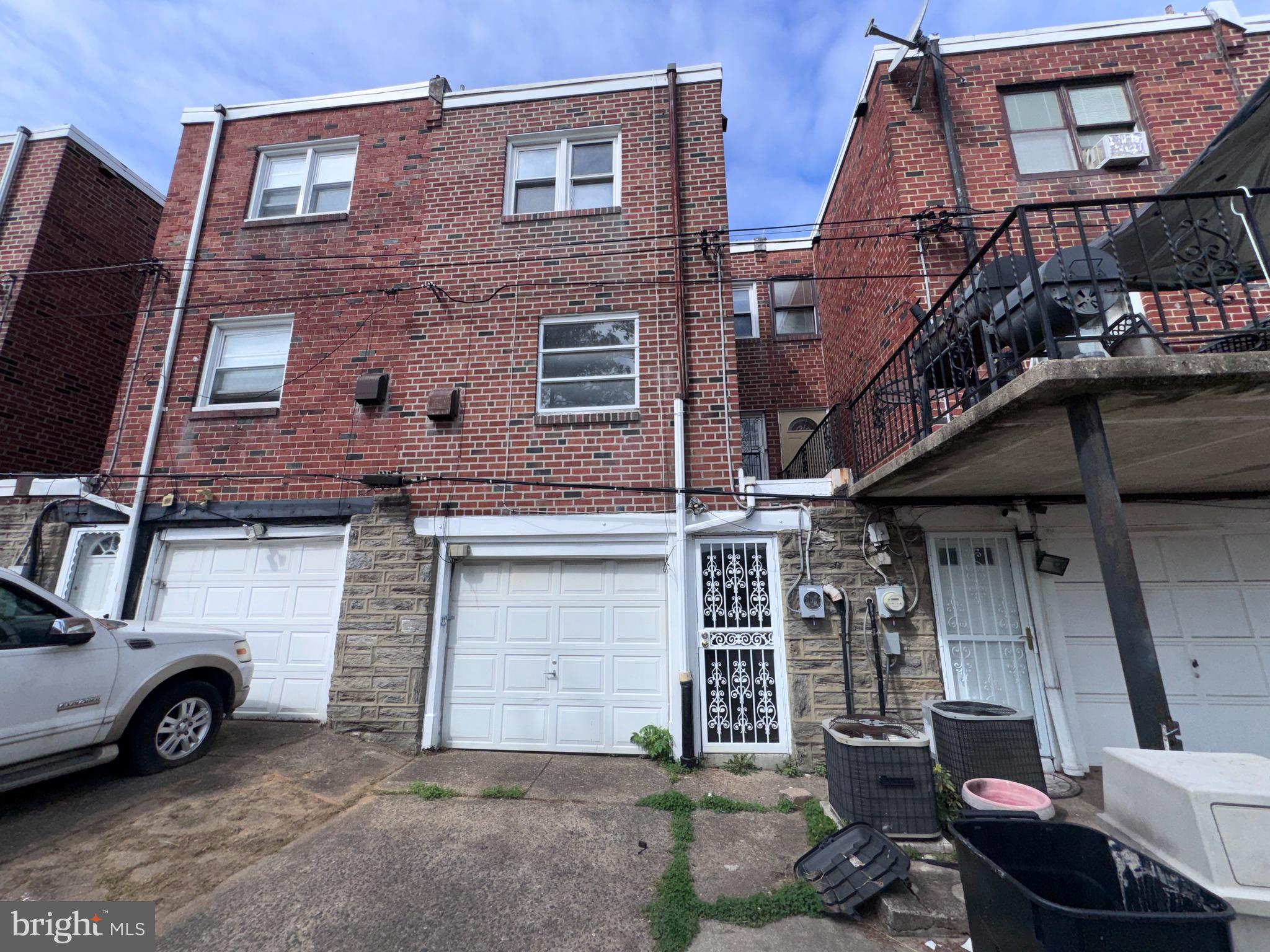 7448 Rhoads Street Philadelphia, PA 19151 - Photo 2 of 17 a view of a car park in front of building