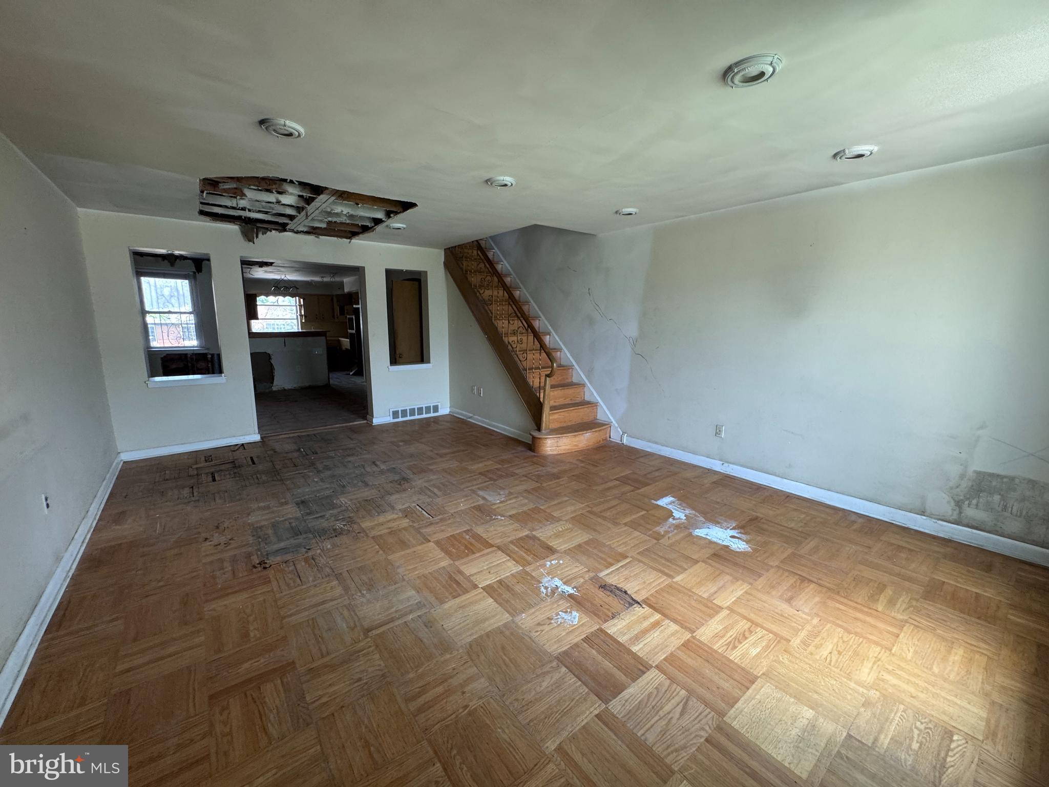 7448 Rhoads Street Philadelphia, PA 19151 - Photo 4 of 17 a view of an empty room with stairs and chandelier