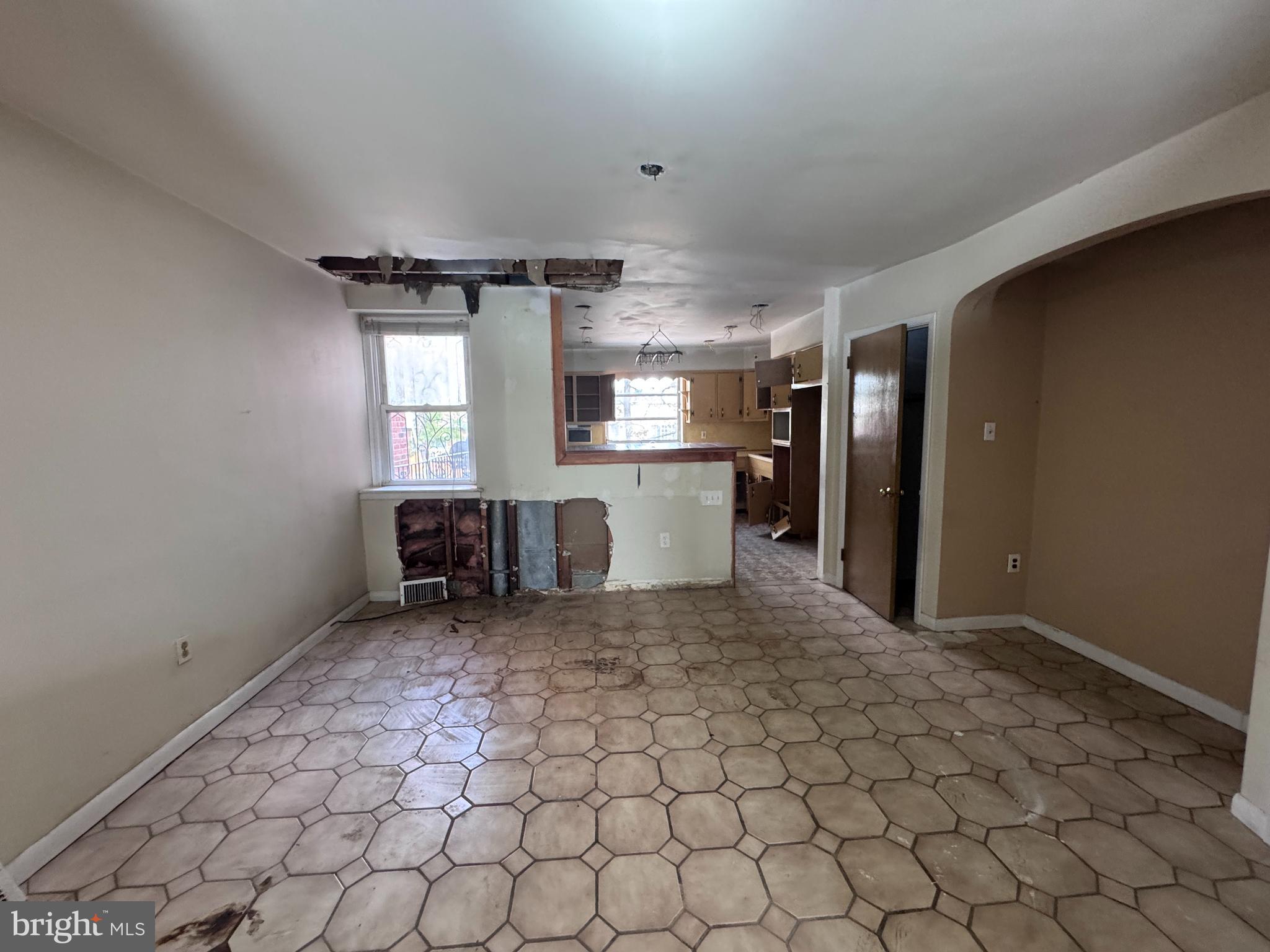 7448 Rhoads Street Philadelphia, PA 19151 - Photo 5 of 17 a view of a refrigerator and microwave in a room