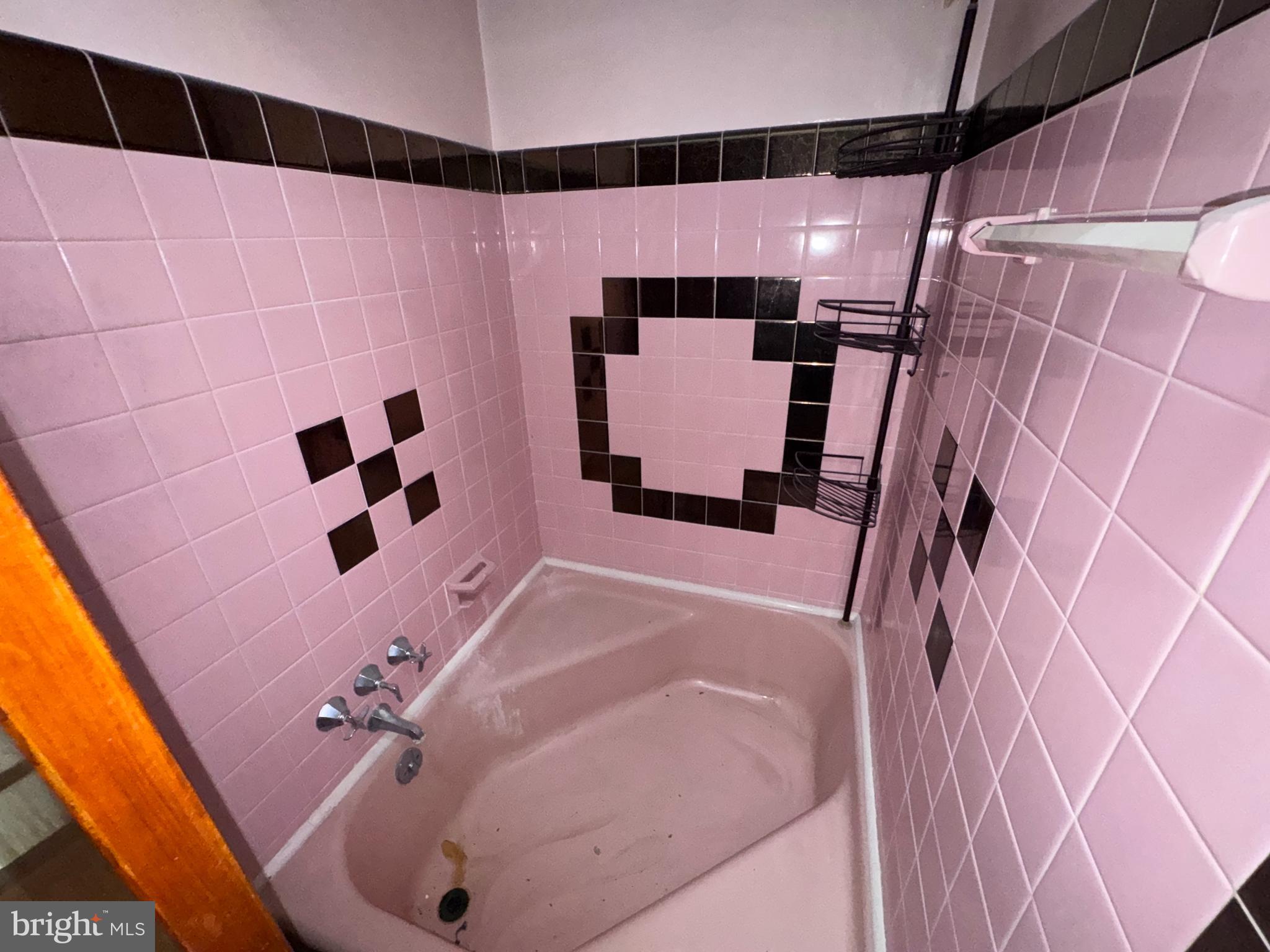 7448 Rhoads Street Philadelphia, PA 19151 - Photo 10 of 17 a bathroom with a bathtub and shower