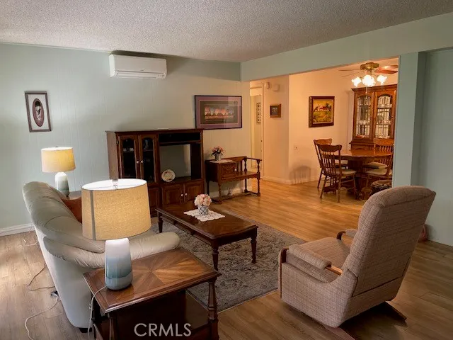 a living room with furniture and a lamp