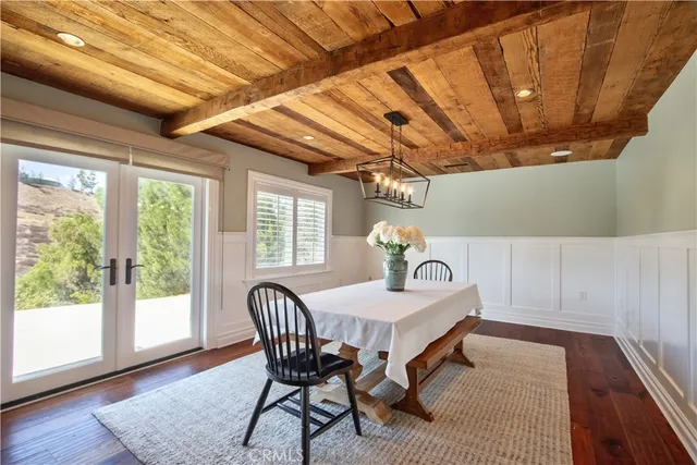 a bathroom with a granite countertop sink mirror toilet and bathtub