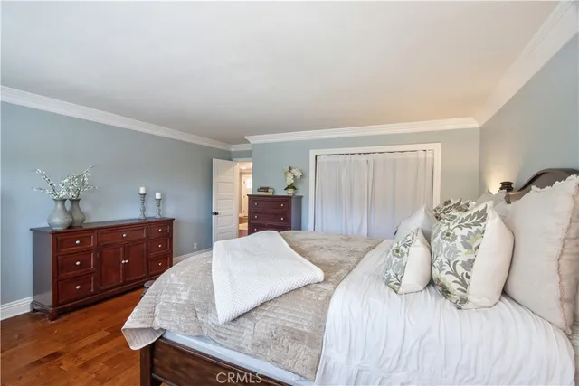 a bedroom with a bed and a tv