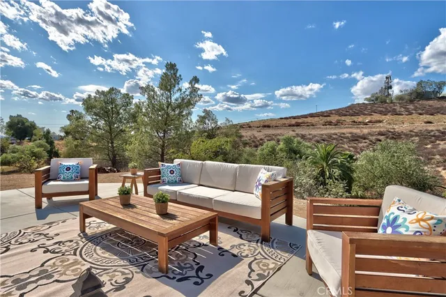 a view of a terrace with couches and a coffee table