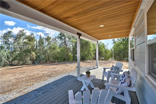 a view of a patio with table and chairs