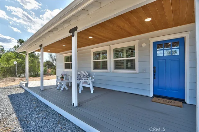 a living room with furniture and stairs