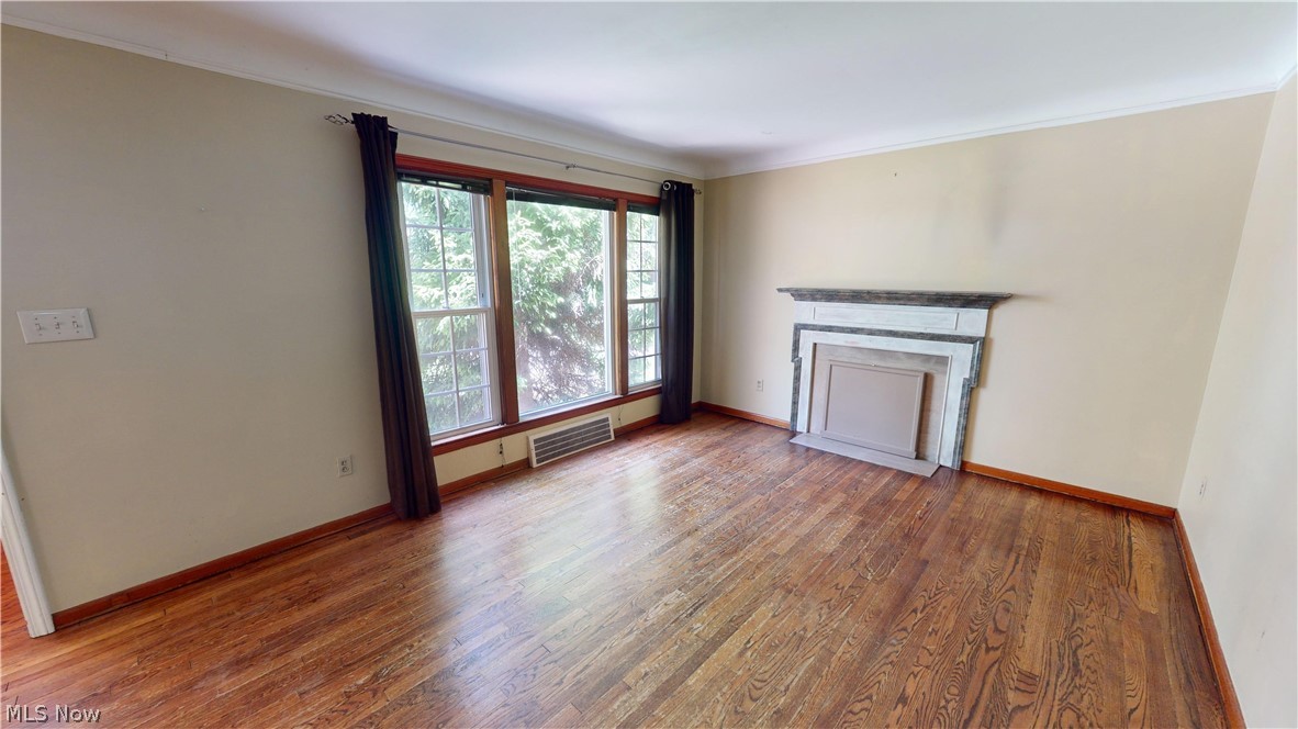 4334 West Anderson Road South Euclid, OH 44121 - Photo 2 of 12 Living room featuring ornamental molding and Hardwood flooring