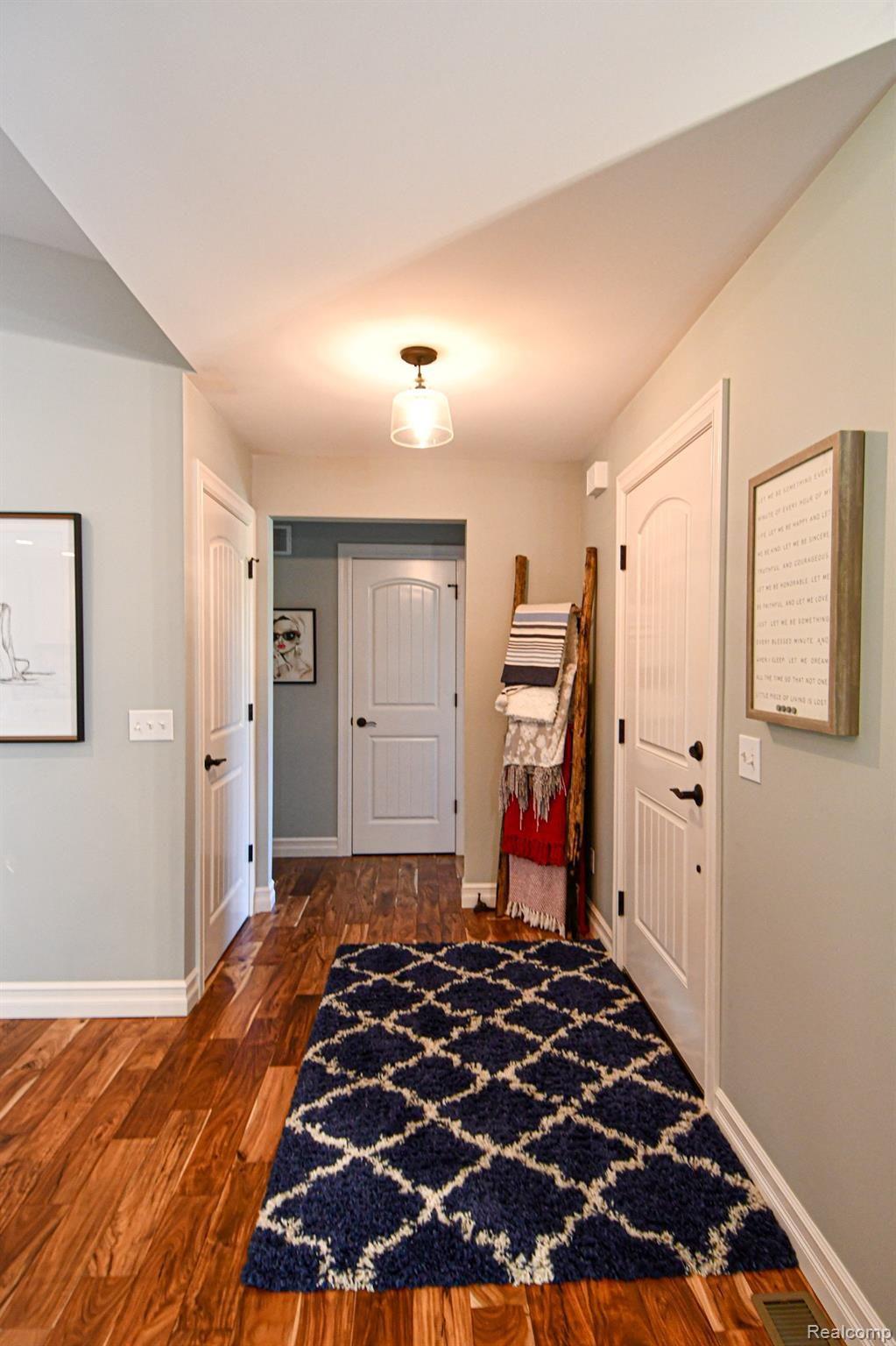 ABSOLUTELY GORGEOUS ACACIA WOOD FLOORING THROUGHOUT!