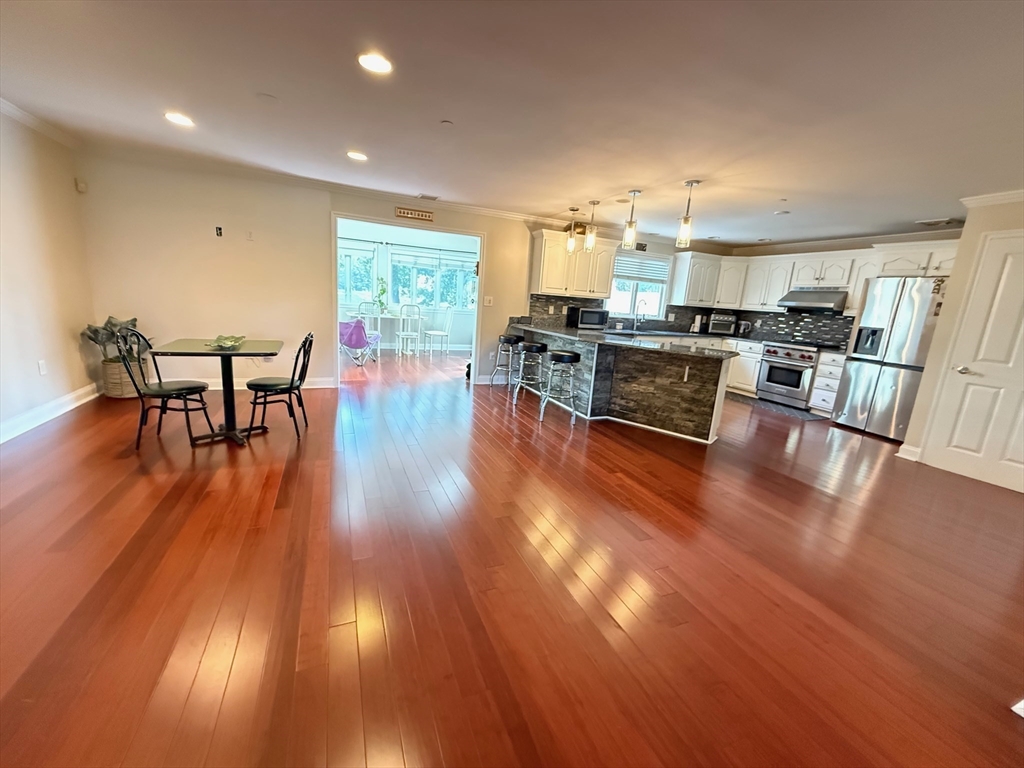 218 Rangeway Road, Unit 213 Billerica, MA 01862 - Photo 11 of 29 a living room with furniture and a wooden floor