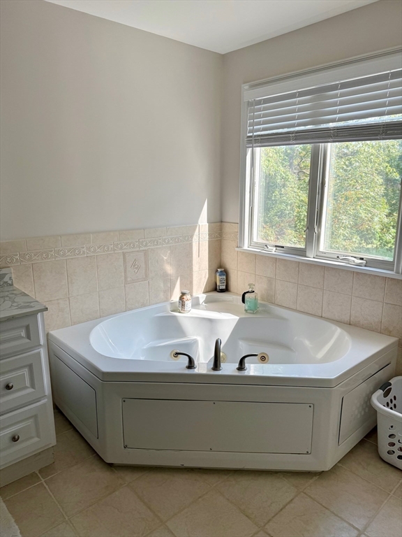 218 Rangeway Road, Unit 213 Billerica, MA 01862 - Photo 18 of 29 a bath tub sitting in a bathroom next to a window