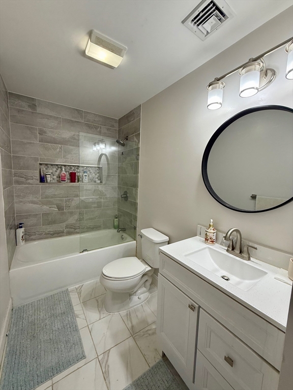218 Rangeway Road, Unit 213 Billerica, MA 01862 - Photo 22 of 29 a bathroom with a sink a toilet and bathtub