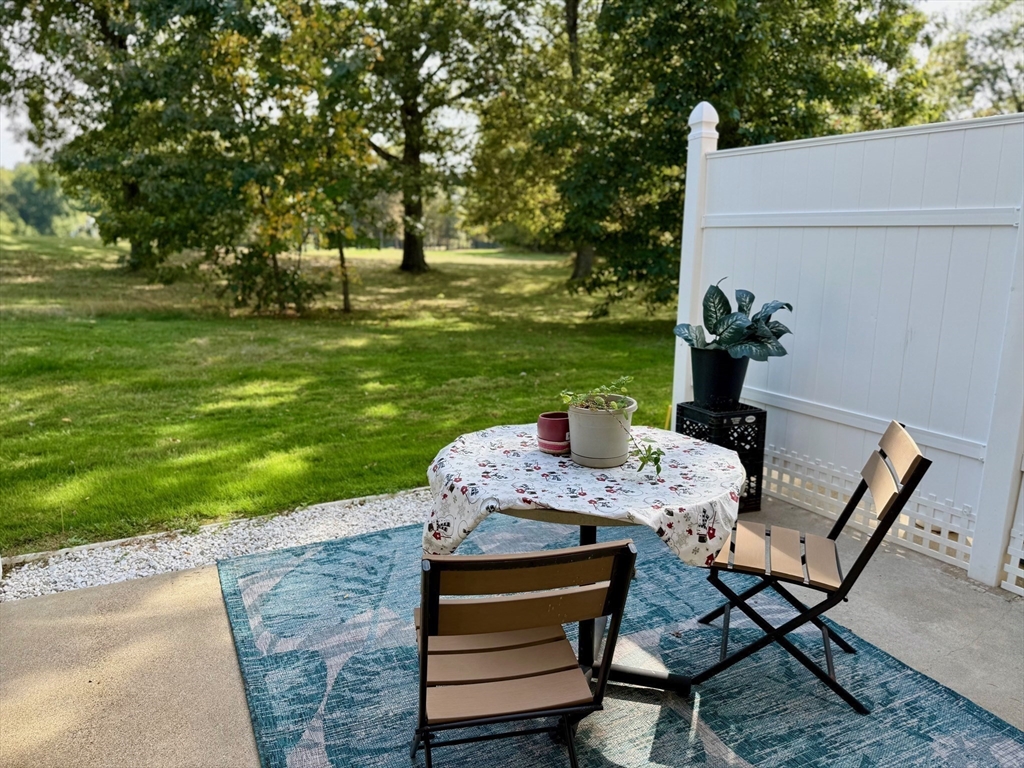 218 Rangeway Road, Unit 213 Billerica, MA 01862 - Photo 29 of 29 a wooden bench sitting in the middle of a park
