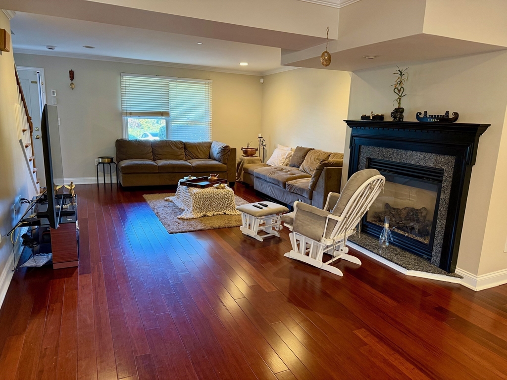 218 Rangeway Road, Unit 213 Billerica, MA 01862 - Photo 7 of 29 a living room with furniture and a fireplace