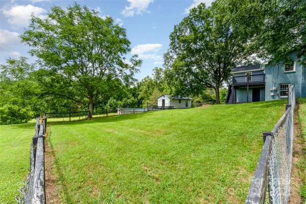a view of a house with a big yard
