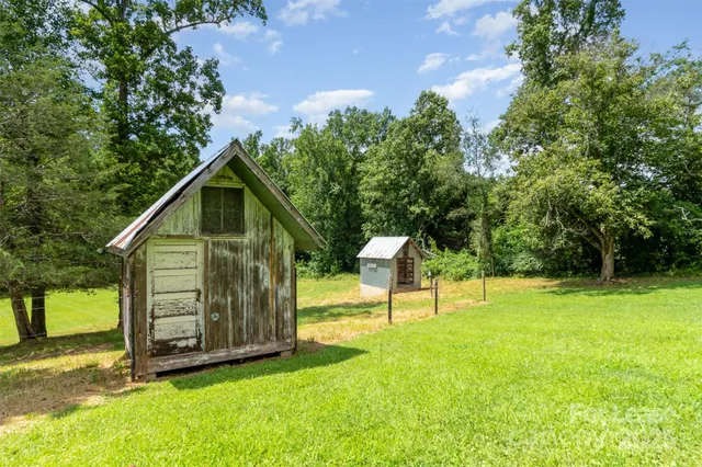 a view of a tiny house with a yard