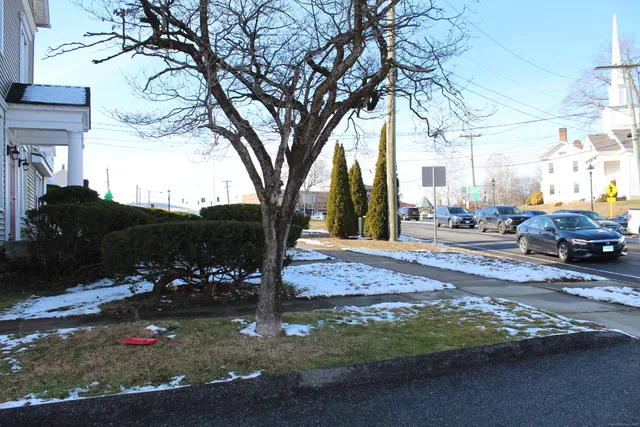 a view of street with parked cars
