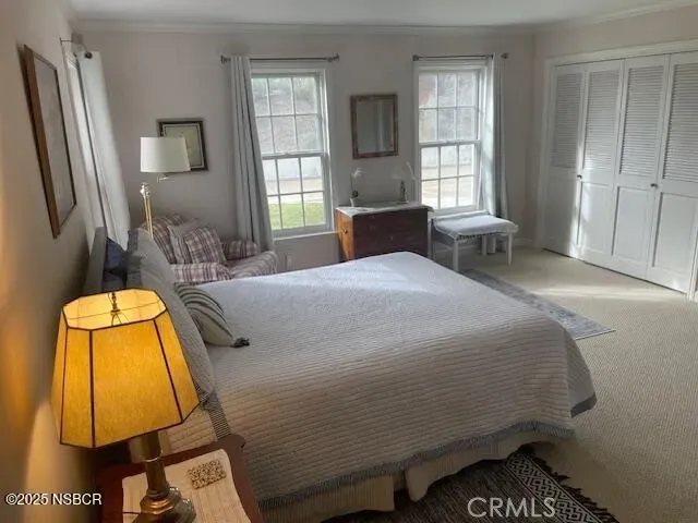 a bedroom with a bed and lamp