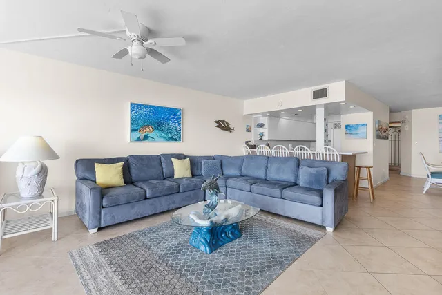 a living room with furniture and a rug