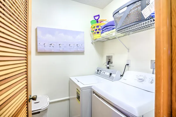 a bathroom with a sink mirror and vanity