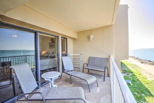 a view of a swimming pool with an outdoor seating